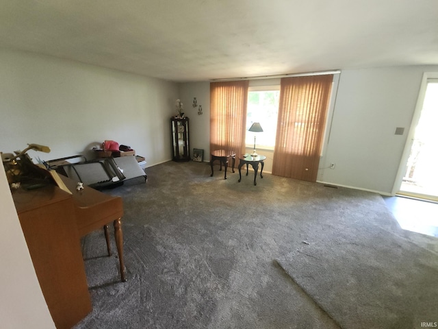 803 Stanley St, Logansport, IN 46947 - living area with carpet and baseboards