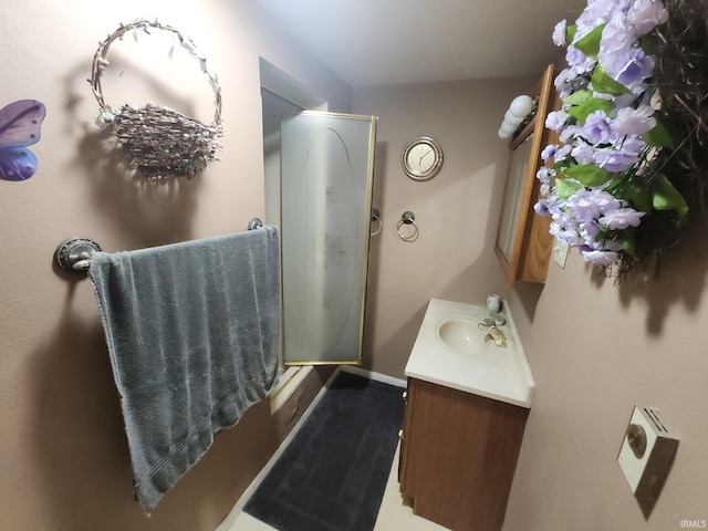 803 Stanley St, Logansport, IN 46947 - bathroom with vanity and baseboards