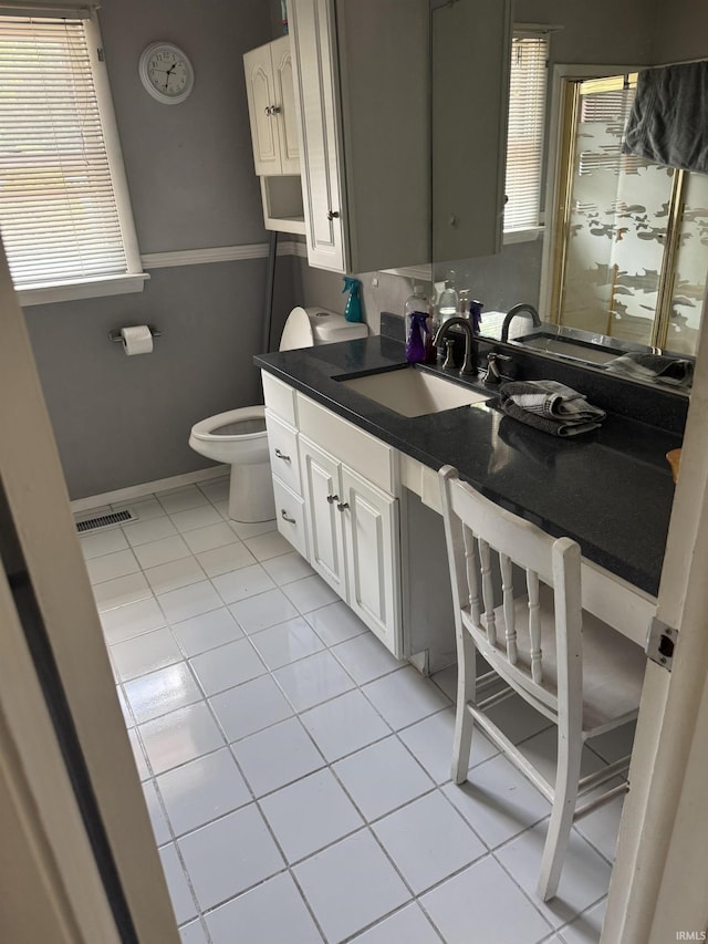 803 Stanley St, Logansport, IN 46947 - bathroom with tile patterned floors, vanity, and healthy amount of natural light