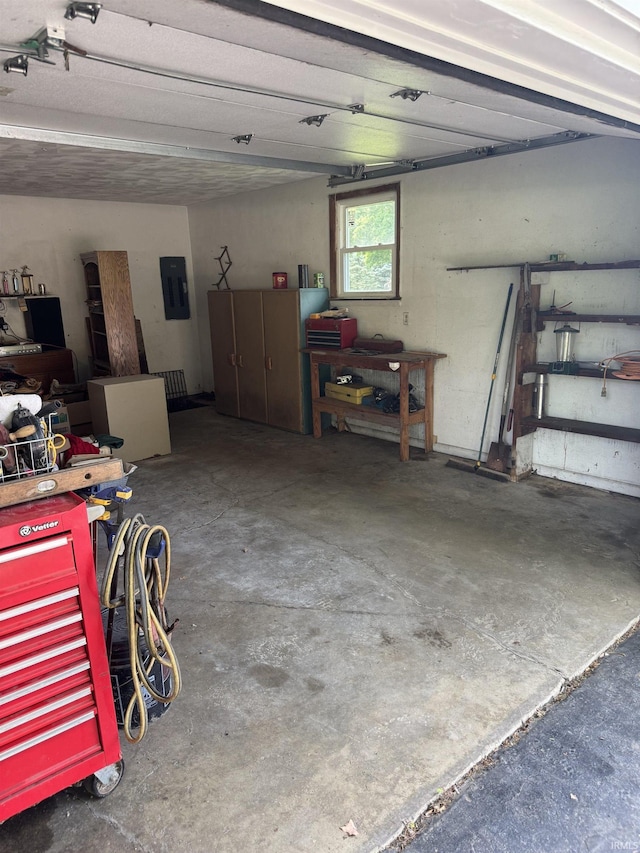 803 Stanley St, Logansport, IN 46947 - garage with electric panel and a workshop area