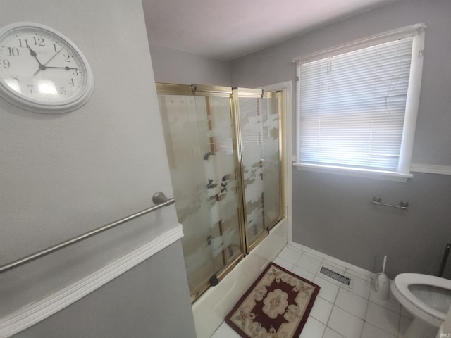 803 Stanley St, Logansport, IN 46947 - bathroom with bath / shower combo with glass door and tile patterned floors