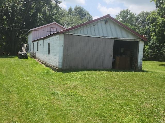 803 Stanley St, Logansport, IN 46947 - view of pole building with a lawn and a garage