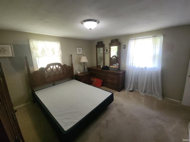 803 Stanley St, Logansport, IN 46947 - carpeted bedroom featuring baseboards