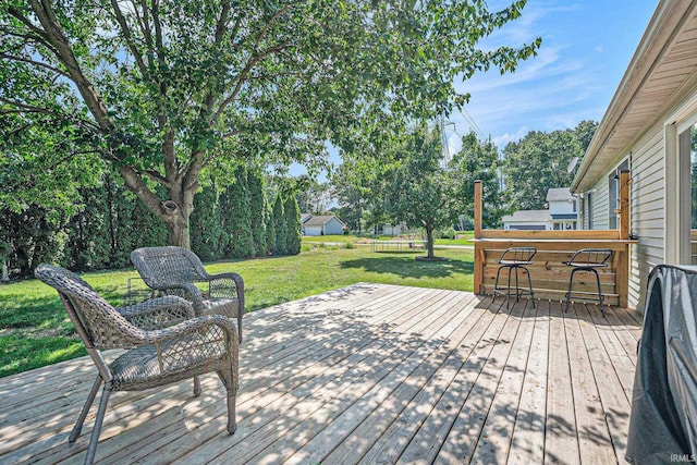 23200 S Oakleaf Dr, Elkhart, IN 46514 - wooden terrace featuring a yard, grilling area, and view of scattered trees