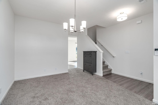 197 Folkston Way, Lafayette, IN 47905 - unfurnished living room featuring stairs, a chandelier, and carpet