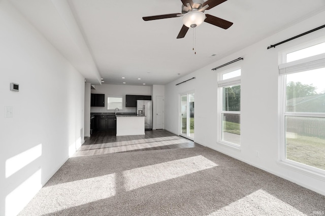 197 Folkston Way, Lafayette, IN 47905 - unfurnished living room with light carpet, a ceiling fan, and recessed lighting
