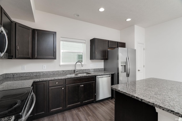 197 Folkston Way, Lafayette, IN 47905 - kitchen with appliances with stainless steel finishes, dark wood finished floors, recessed lighting, and light stone countertops