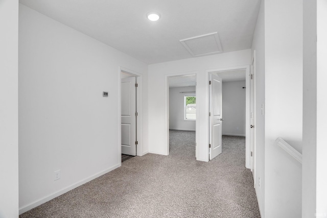 197 Folkston Way, Lafayette, IN 47905 - spare room featuring carpet floors and attic access