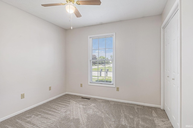 4211 Anchor Dr, Mishawaka, IN 46544 - unfurnished bedroom featuring carpet flooring, a closet, and ceiling fan