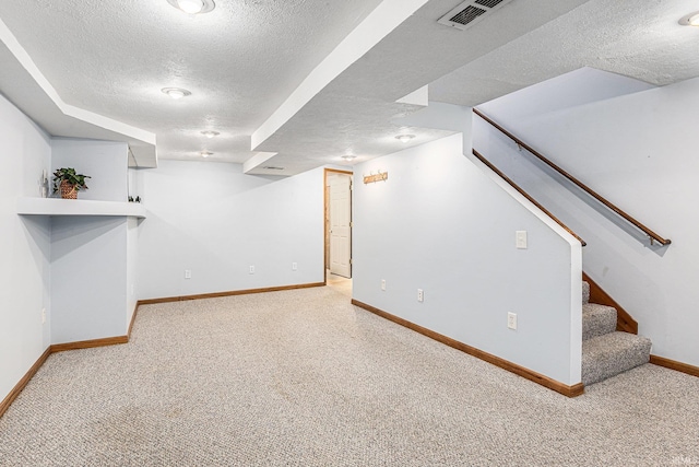 4211 Anchor Dr, Mishawaka, IN 46544 - finished basement featuring a textured ceiling, carpet floors, and stairway