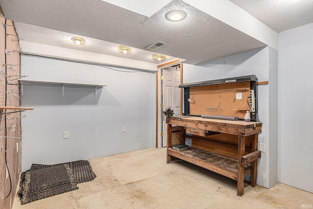 4211 Anchor Dr, Mishawaka, IN 46544 - finished below grade area featuring a textured ceiling and a workshop area