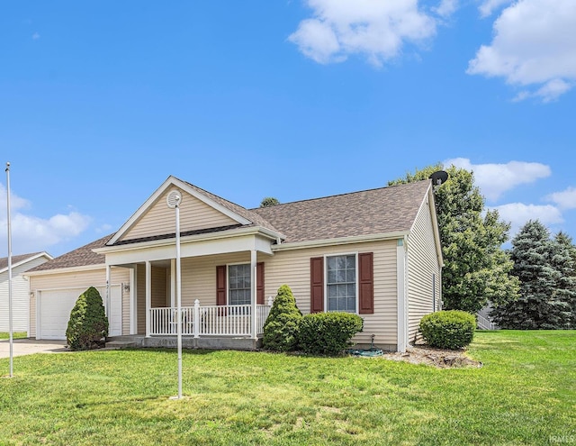 4211 Anchor Dr, Mishawaka, IN 46544 - view of front facade with covered porch, a garage, a front yard, and concrete driveway