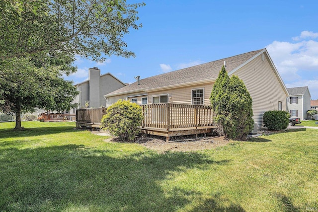 4211 Anchor Dr, Mishawaka, IN 46544 - rear view of house with a deck and a lawn