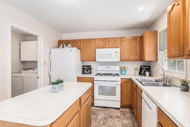 4211 Anchor Dr, Mishawaka, IN 46544 - kitchen with white appliances, washing machine and dryer, light countertops, stone finish flooring, and recessed lighting