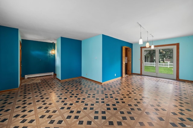 303 N Center St, Boswell, IN 47921 - empty room with baseboard heating and track lighting