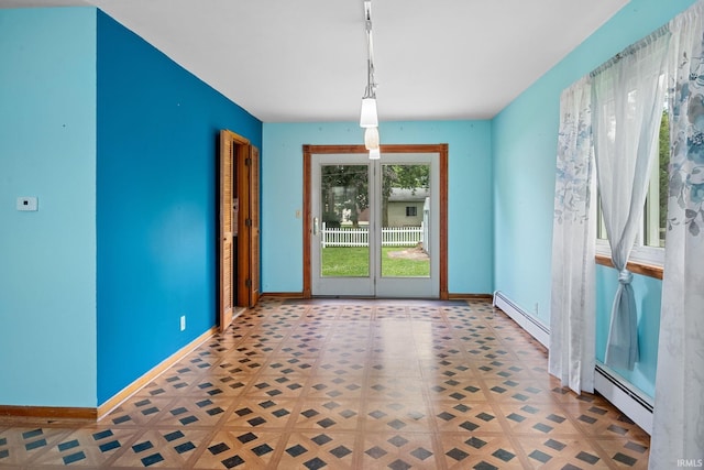 303 N Center St, Boswell, IN 47921 - unfurnished dining area featuring a baseboard heating unit and tile patterned floors