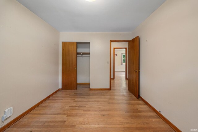 303 N Center St, Boswell, IN 47921 - unfurnished bedroom with light wood-style floors and a closet