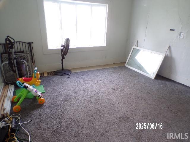 2401 S Selby St, Marion, IN 46953 - rec room with healthy amount of natural light and carpet