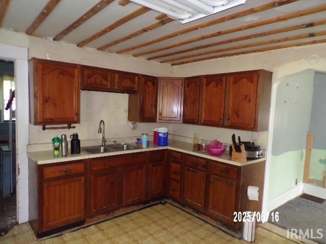 2401 S Selby St, Marion, IN 46953 - kitchen with light countertops, light floors, and brown cabinets