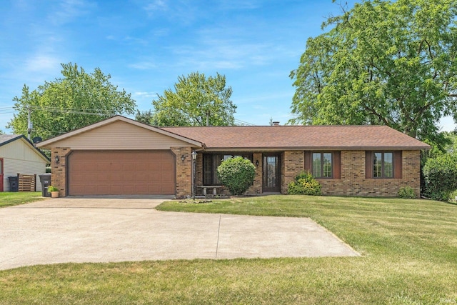 5610 E State Blvd, Fort Wayne, IN 46815 - ranch-style home with brick siding, a garage, a front yard, and driveway