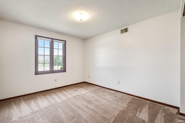 5610 E State Blvd, Fort Wayne, IN 46815 - spare room featuring light colored carpet and a textured ceiling