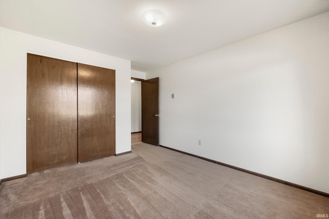 5610 E State Blvd, Fort Wayne, IN 46815 - unfurnished bedroom with a closet and light carpet