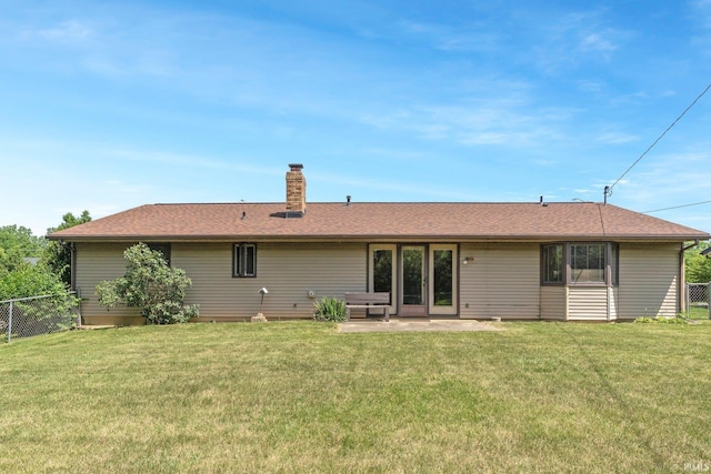 5610 E State Blvd, Fort Wayne, IN 46815 - rear view of house with a chimney, a shingled roof, and a patio