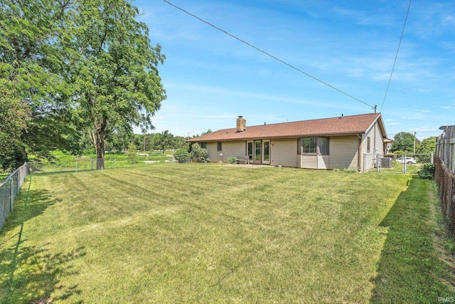 5610 E State Blvd, Fort Wayne, IN 46815 - rear view of property with a chimney and a fenced backyard