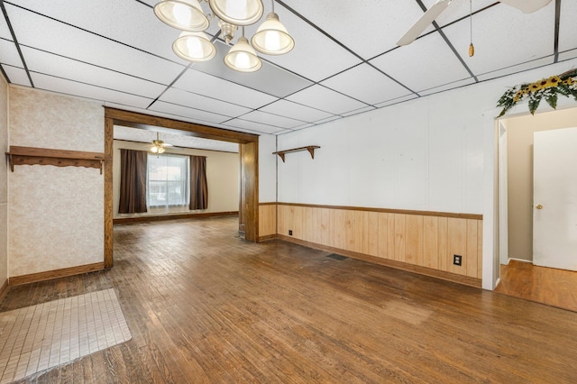 408 E Main St, Butler, IN 46721 - spare room featuring hardwood / wood-style flooring, ceiling fan, and a chandelier