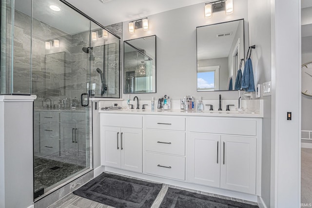 18419 Donegal Dr, South Bend, IN 46637 - bathroom with double vanity and a stall shower