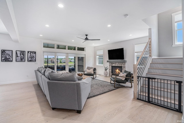 18419 Donegal Dr, South Bend, IN 46637 - living room featuring a stone fireplace, light wood finished floors, healthy amount of natural light, and recessed lighting