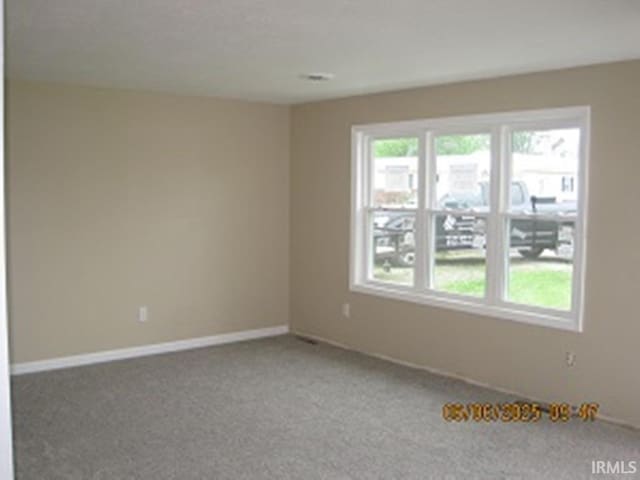 514 W Mcdonald St, Hartford City, IN 47348 - carpeted spare room with baseboards