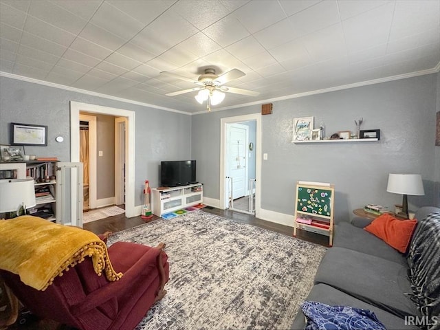 706 E Hoffer St, Kokomo, IN 46902 - living area with crown molding, wood finished floors, ceiling fan, and a textured wall