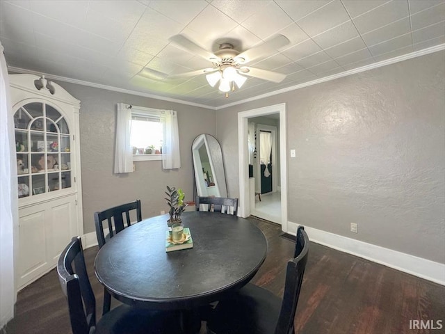 706 E Hoffer St, Kokomo, IN 46902 - dining space with a textured wall, ornamental molding, wood finished floors, and a ceiling fan