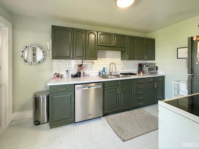 706 E Hoffer St, Kokomo, IN 46902 - kitchen with stainless steel dishwasher, green cabinets, and backsplash