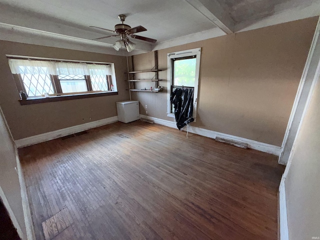 1800 High St, Logansport, IN 46947 - unfurnished bedroom featuring multiple windows, wood finished floors, and ceiling fan