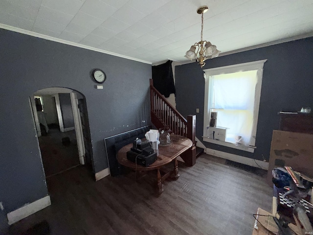 1800 High St, Logansport, IN 46947 - dining space with arched walkways, ornamental molding, wood finished floors, a chandelier, and stairway