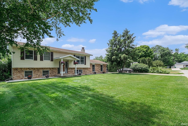26946 Heather Ln, Elkhart, IN 46514 - raised ranch with a front lawn and a chimney
