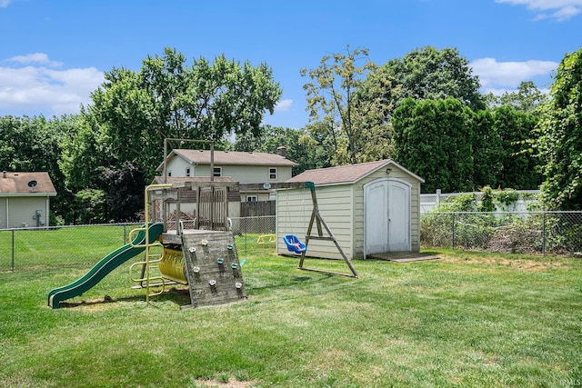 26946 Heather Ln, Elkhart, IN 46514 - fenced backyard featuring a playground, a storage unit, and view of wooded area