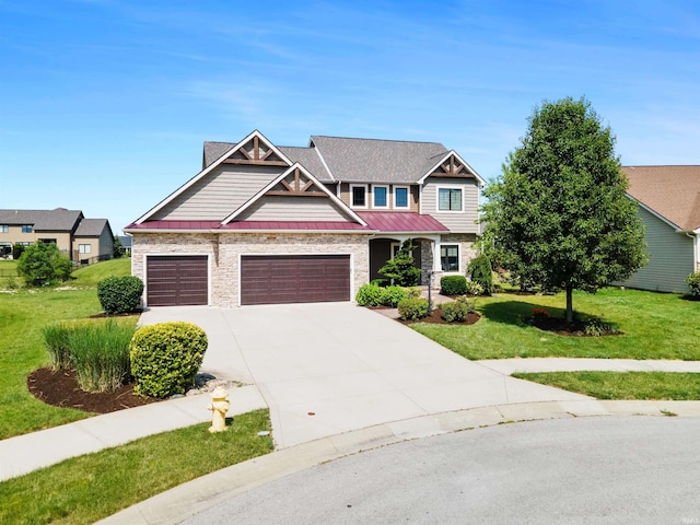 188 Begonia Ct, Fort Wayne, IN 46814 - craftsman-style house with an attached garage, a front yard, driveway, a standing seam roof, and stone siding
