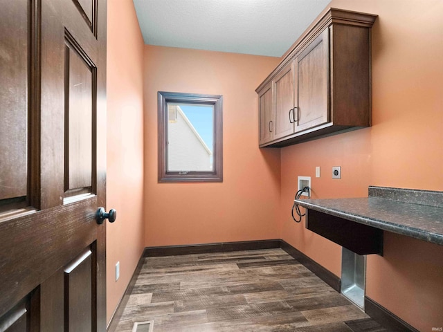 188 Begonia Ct, Fort Wayne, IN 46814 - laundry room with electric dryer hookup, cabinet space, dark wood-type flooring, and washer hookup