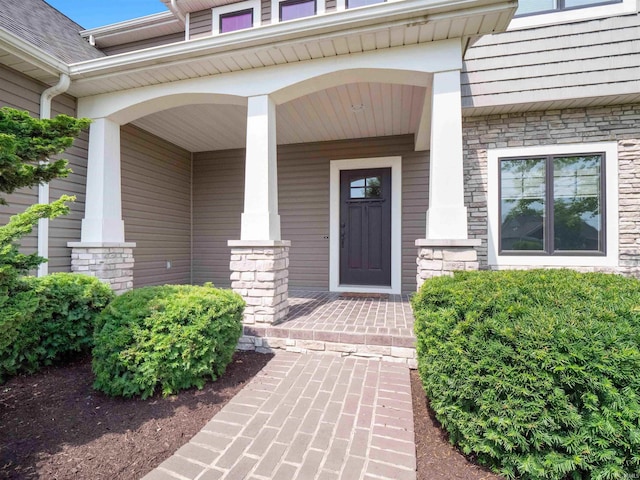188 Begonia Ct, Fort Wayne, IN 46814 - property entrance with stone siding and a porch
