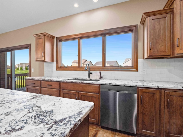 188 Begonia Ct, Fort Wayne, IN 46814 - kitchen featuring dishwasher, backsplash, brown cabinets, and recessed lighting