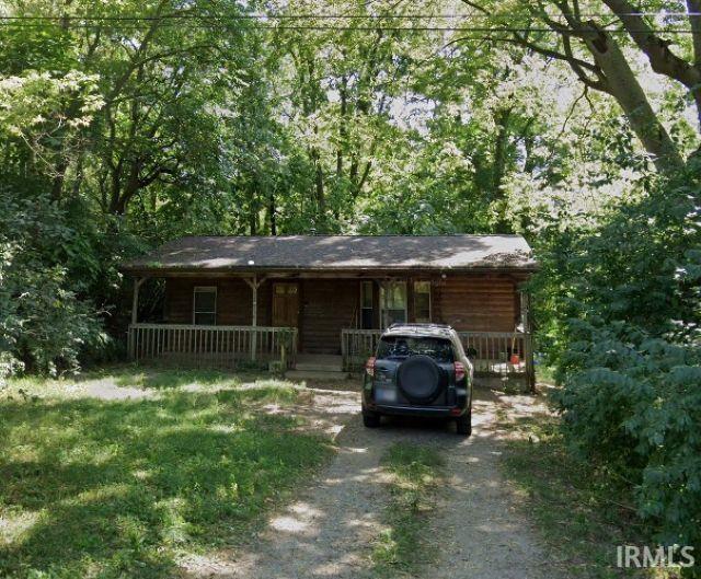 1419 Huestis Ave, Fort Wayne, IN 46807 - view of front of house with a porch and dirt driveway