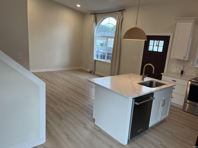 732 Conner Dr, Mishawaka, IN 46544 - kitchen with dishwasher, light wood-style floors, a kitchen island with sink, stainless steel electric stove, and white cabinetry