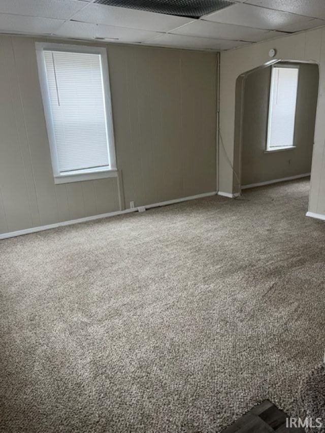634 Walnut St, Fort Wayne, IN 46802 - unfurnished room with carpet flooring and arched walkways
