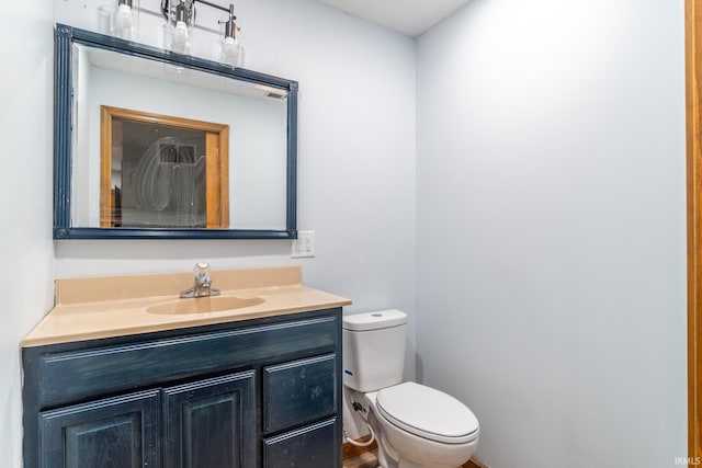 114 Whispering Ln, South Whitley, IN 46787 - half bathroom featuring vanity and toilet