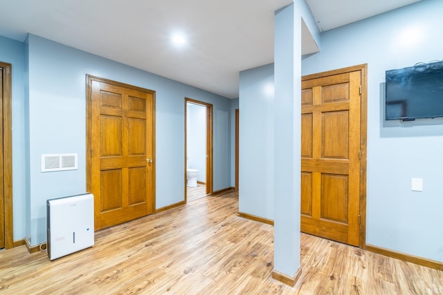114 Whispering Ln, South Whitley, IN 46787 - empty room featuring light wood finished floors and recessed lighting