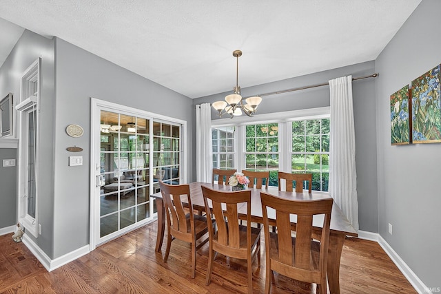 51733 Copperfield Rdg, Granger, IN 46530 - dining area featuring wood finished floors and a chandelier