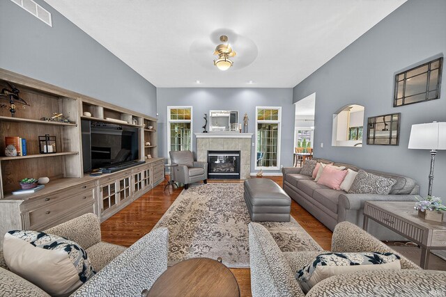 51733 Copperfield Rdg, Granger, IN 46530 - living area with wood finished floors, a fireplace, and ceiling fan